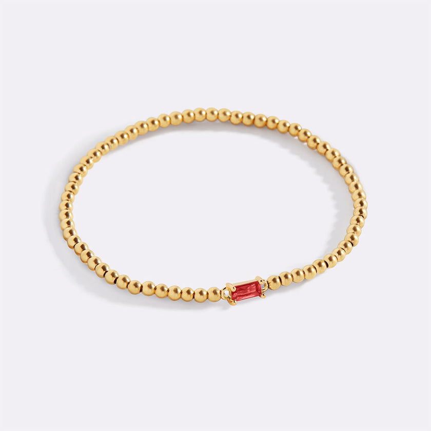 Pulsera de cuentas doradas con piedra natal