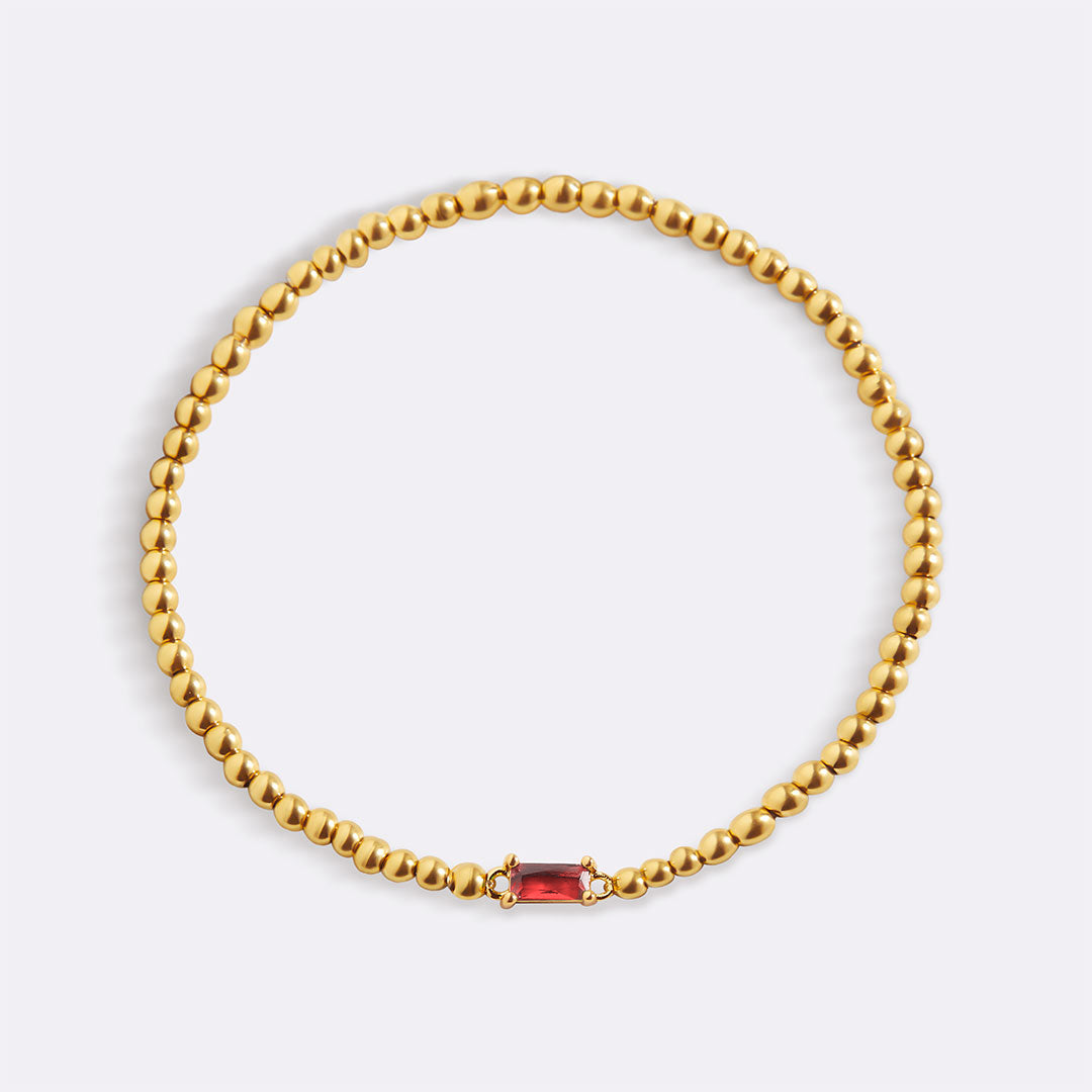 Pulsera de cuentas doradas con piedra natal