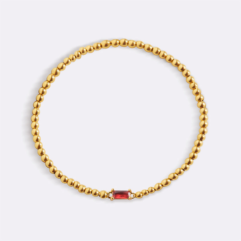 Pulsera de cuentas doradas con piedra natal