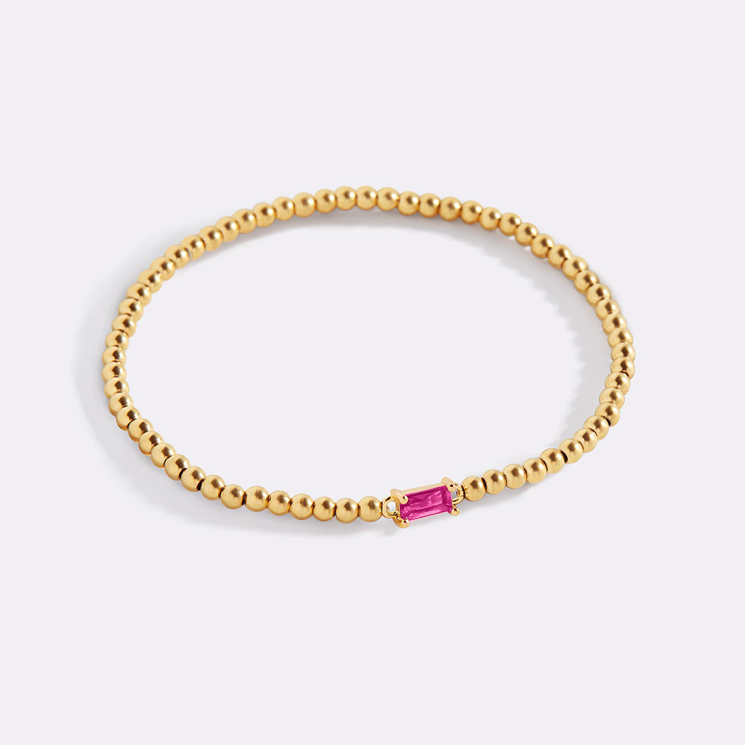 Pulsera de cuentas doradas con piedra natal