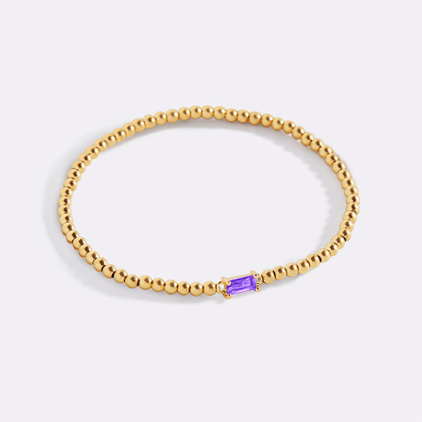 Pulsera de cuentas doradas con piedra natal