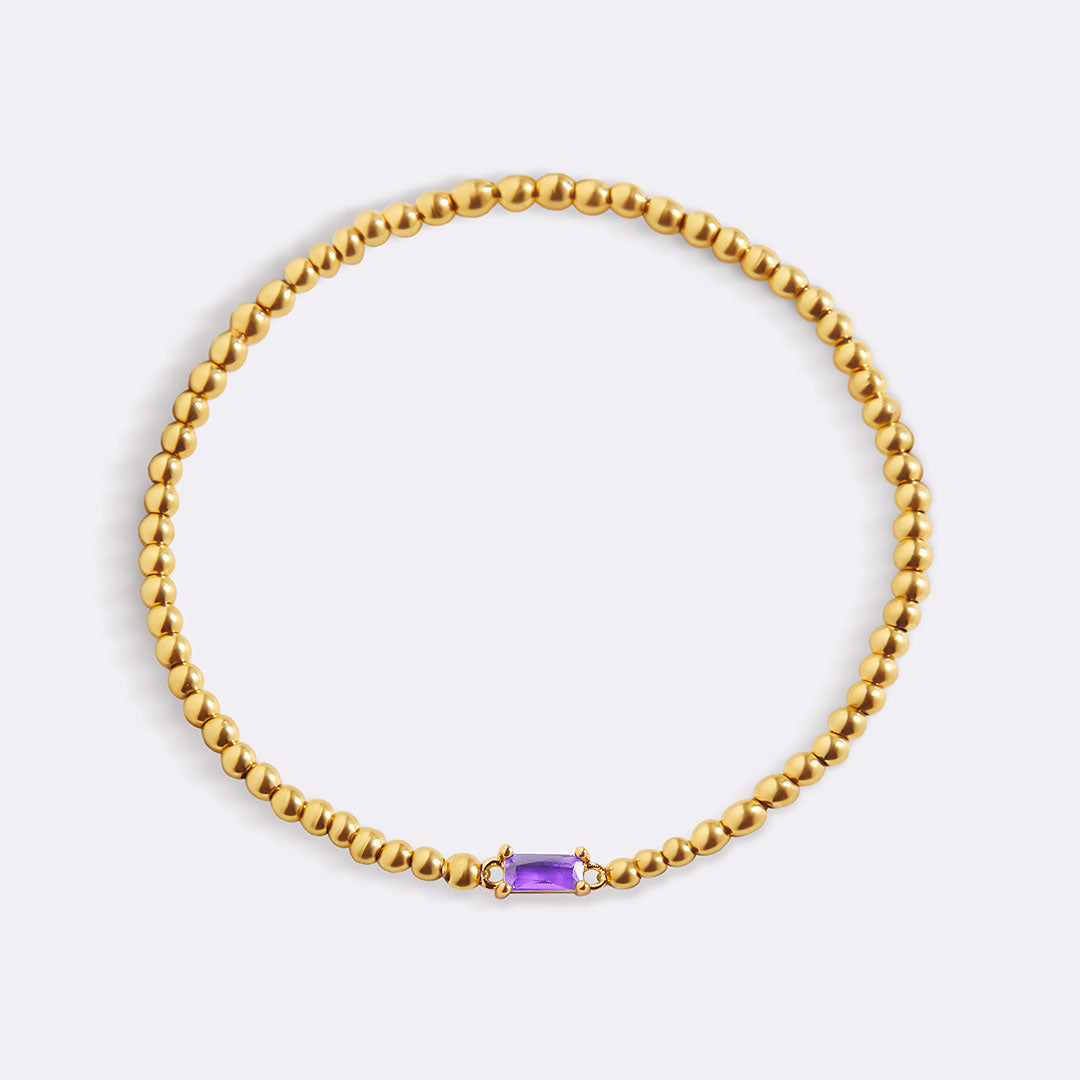 Pulsera de cuentas doradas con piedra natal