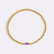 Pulsera de cuentas doradas con piedra natal