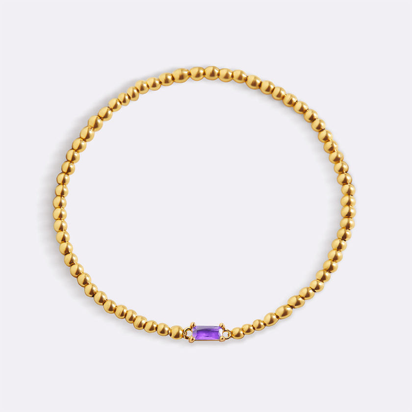 Pulsera de cuentas doradas con piedra natal
