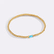 Pulsera de cuentas doradas con piedra natal