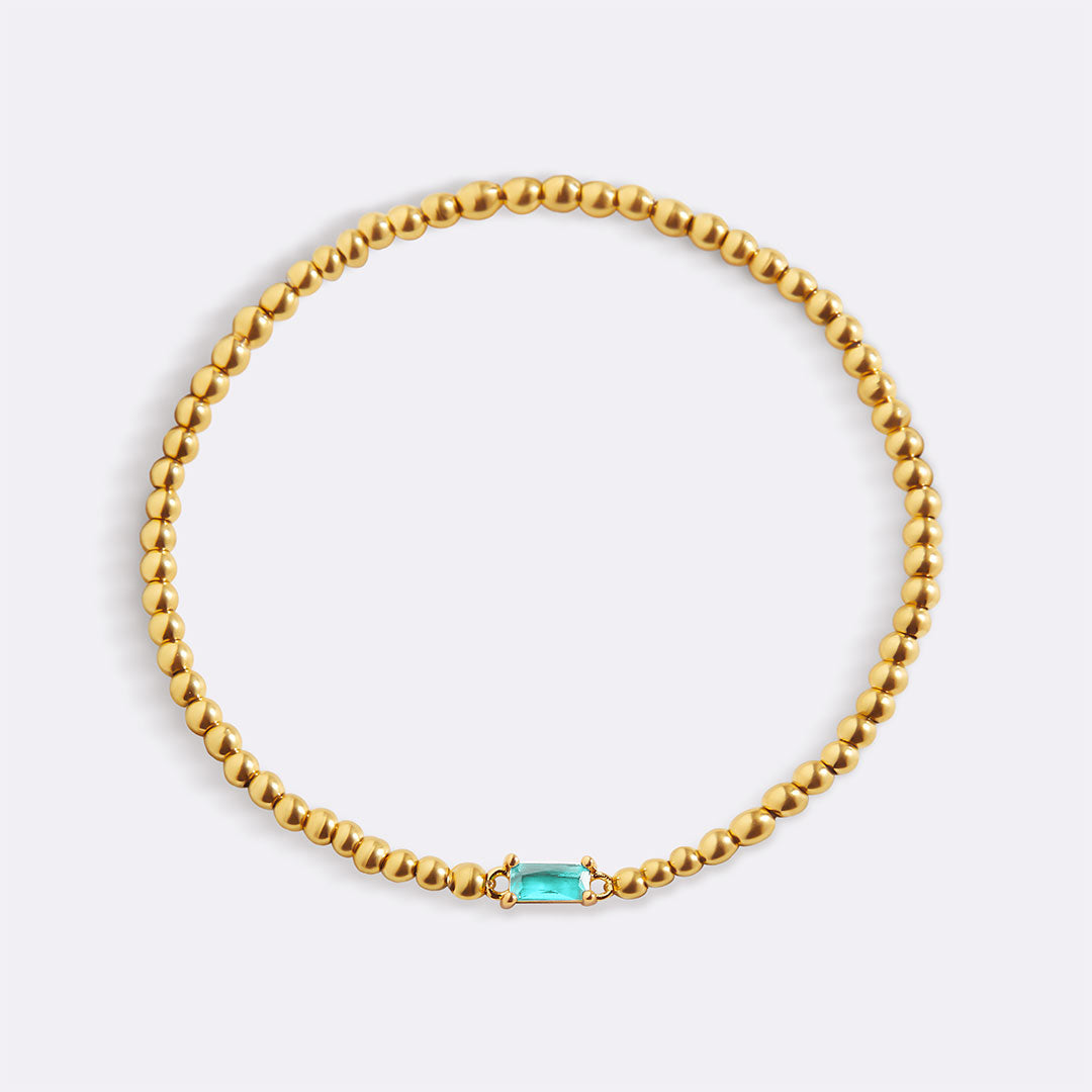 Pulsera de cuentas doradas con piedra natal
