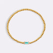 Pulsera de cuentas doradas con piedra natal