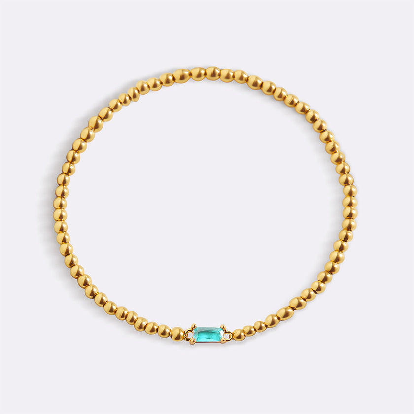 Pulsera de cuentas doradas con piedra natal