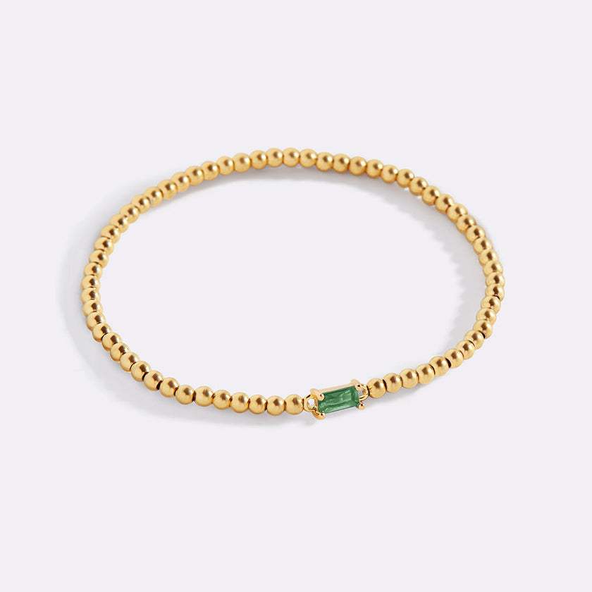 Pulsera de cuentas doradas con piedra natal