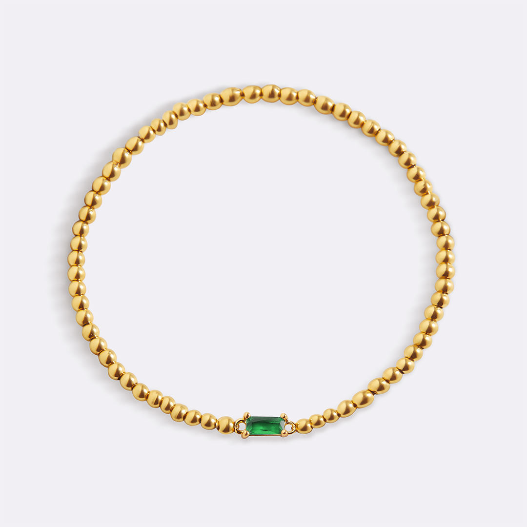 Pulsera de cuentas doradas con piedra natal