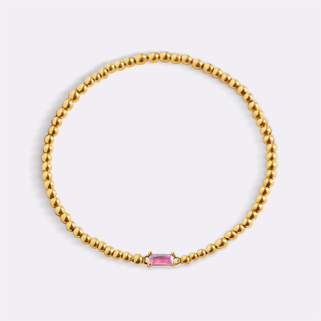 Pulsera de cuentas doradas con piedra natal
