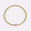 Pulsera de cuentas doradas con piedra natal
