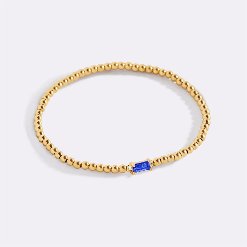 Pulsera de cuentas doradas con piedra natal