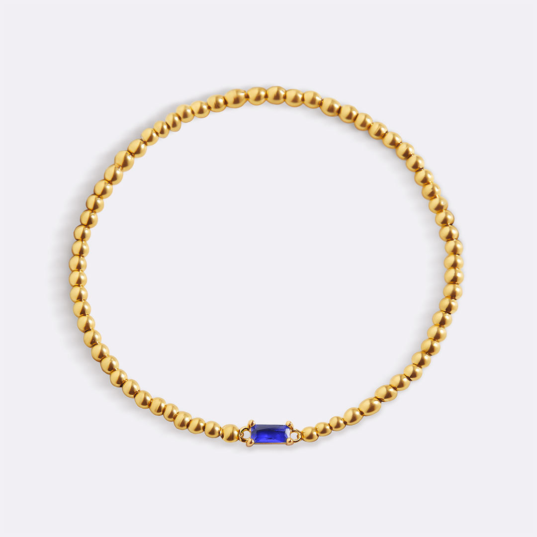 Pulsera de cuentas doradas con piedra natal