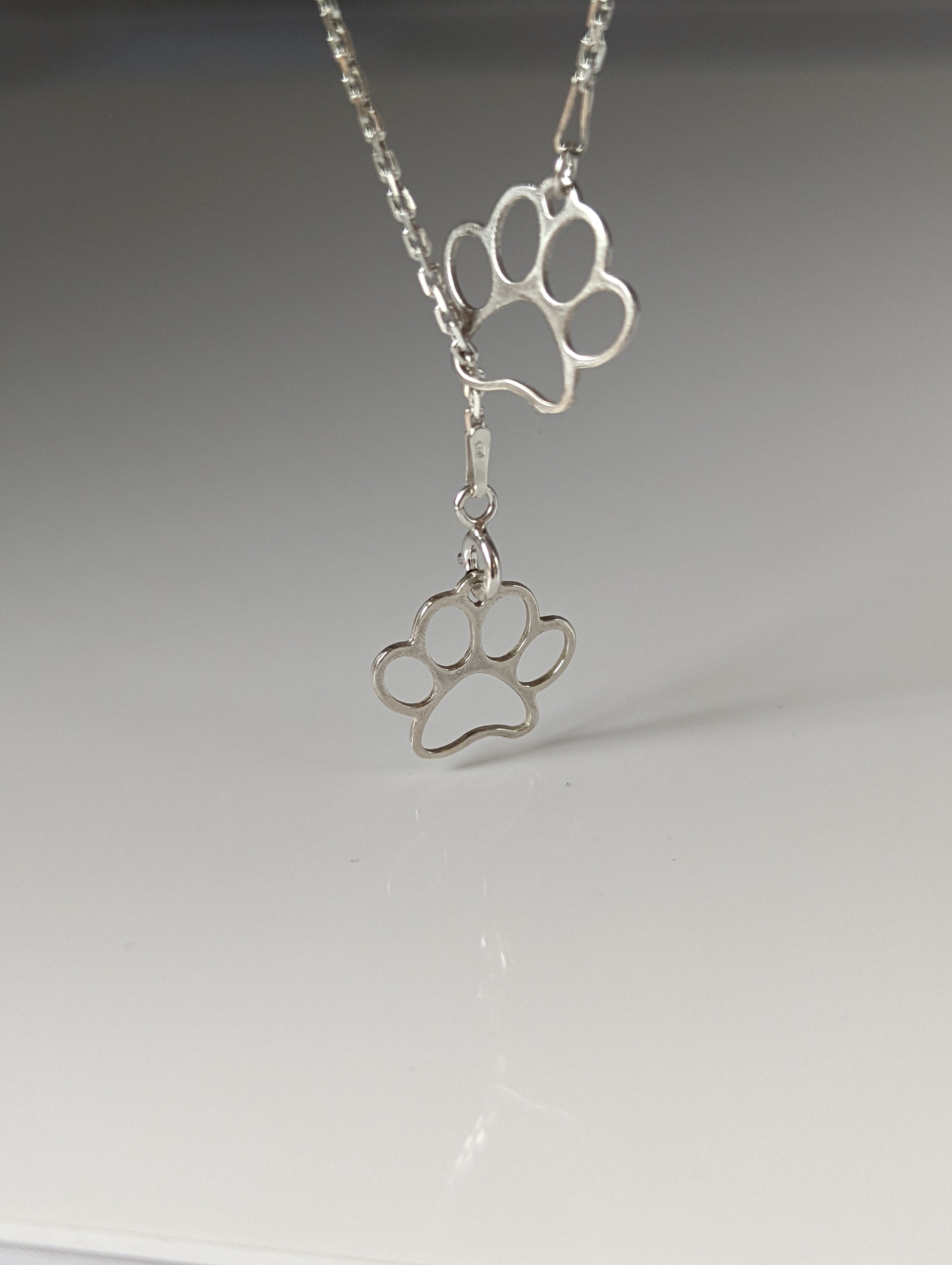 Silver Steed Thread Through Double Paw Print Silver Necklace