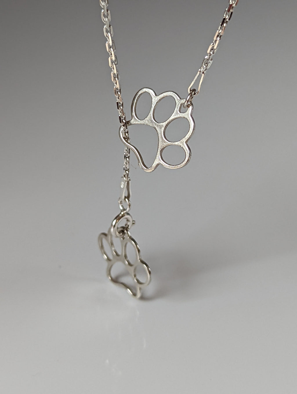 Silver Steed Thread Through Double Paw Print Silver Necklace