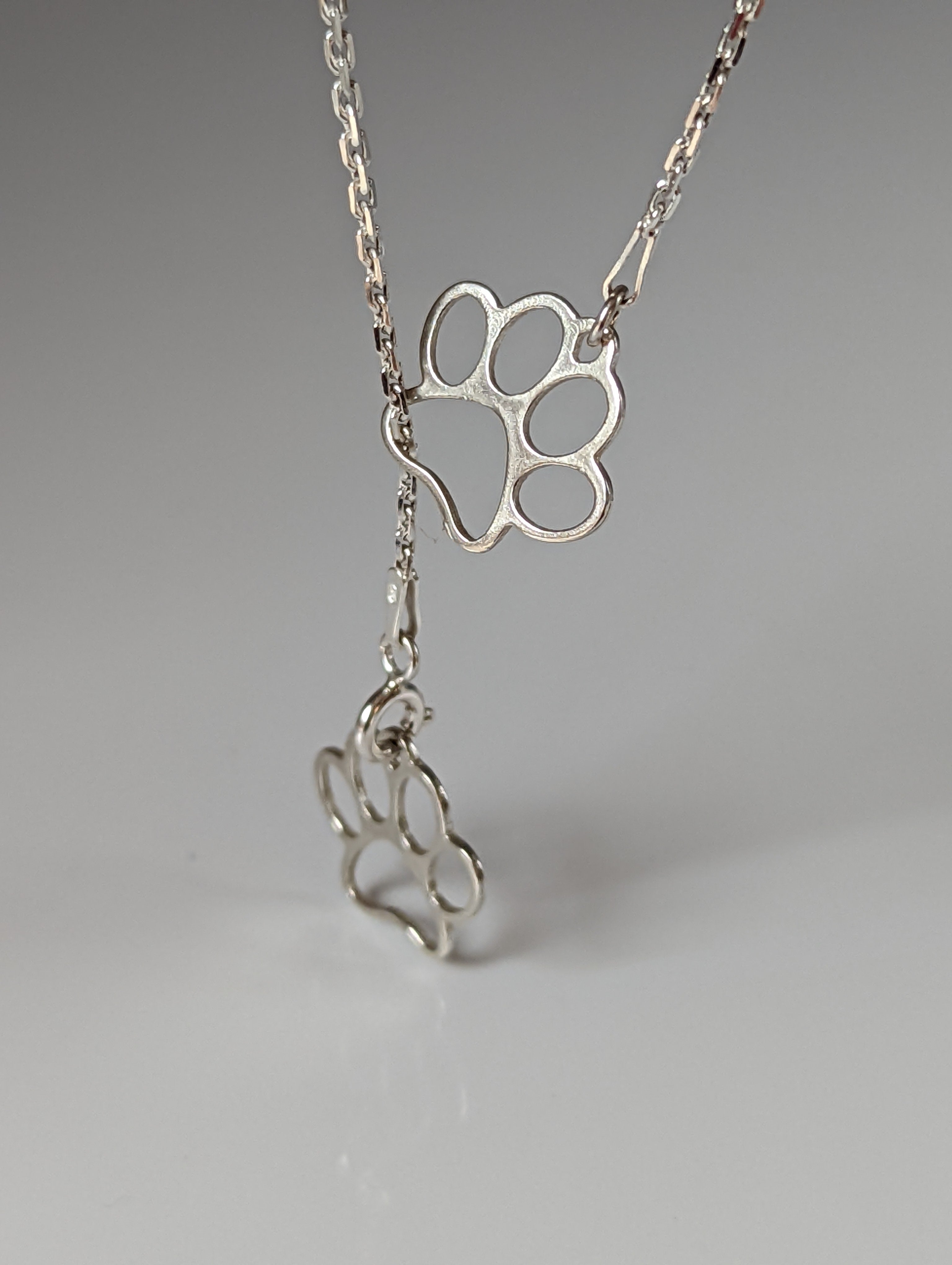 Silver Steed Thread Through Double Paw Print Silver Necklace