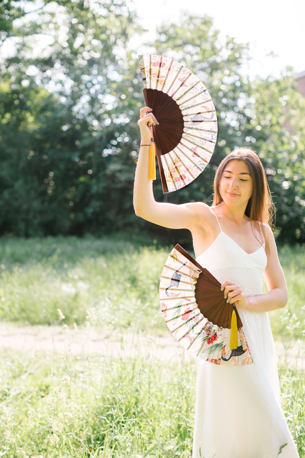 Floral Silk Fan with Toucan design and luxurious Gold tassel, part of the Mysa Collection