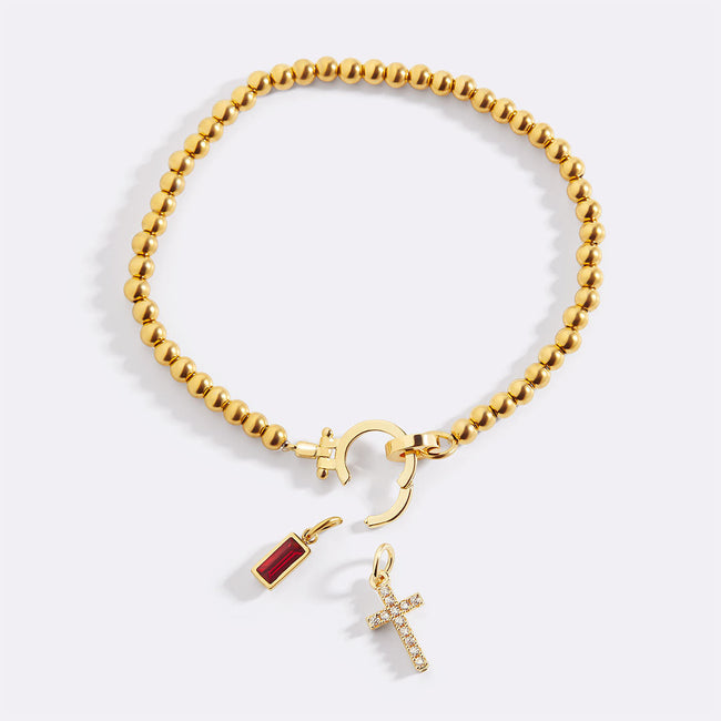 Bracciale con croce e pietra portafortuna