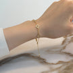 Pulsera de trébol calado en oro