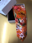 Corbata de seda color naranja óxido, estampado de pradera tropical 'Eden'
