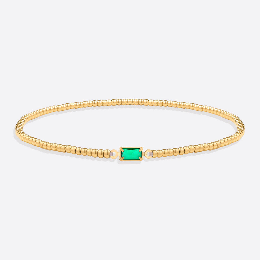 Pulsera de cuentas doradas con piedra natal