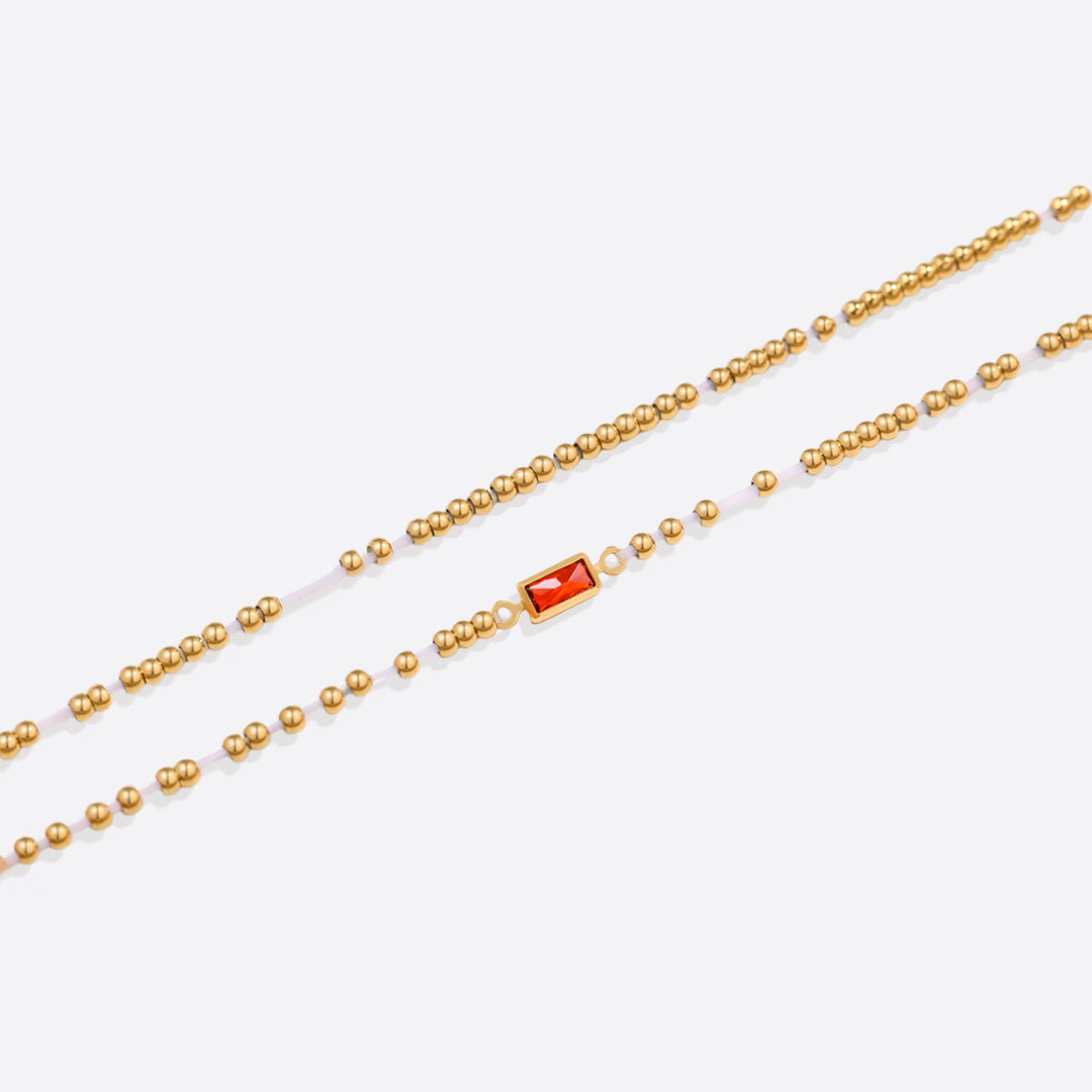 Pulsera de cuentas doradas con piedra natal