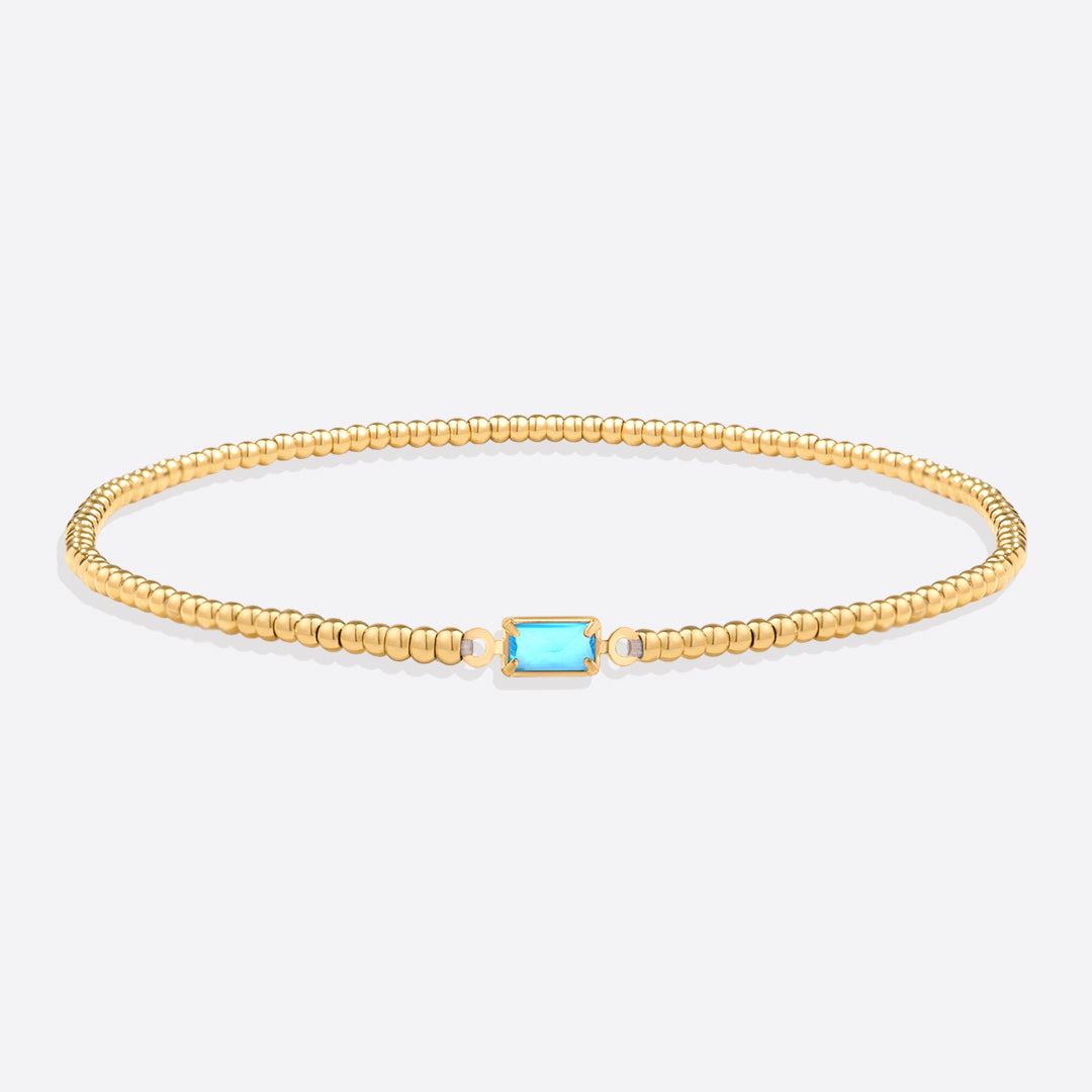 Pulsera de cuentas doradas con piedra natal