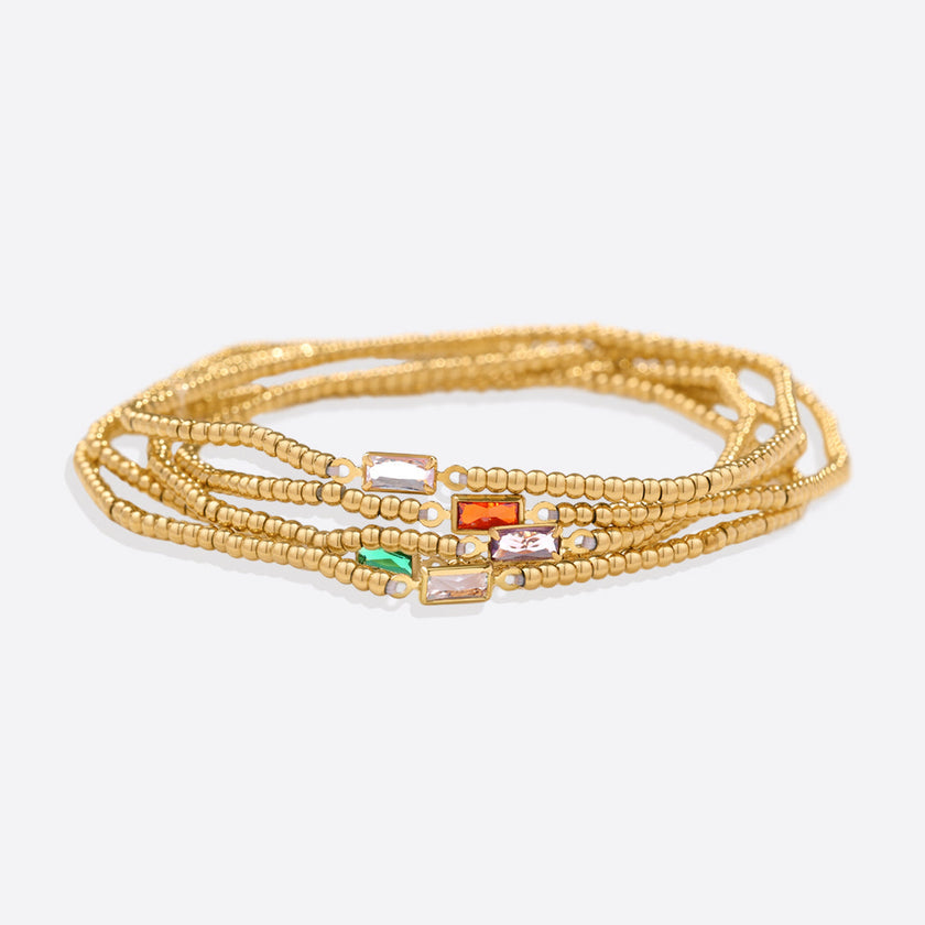 Pulsera de cuentas doradas con piedra natal