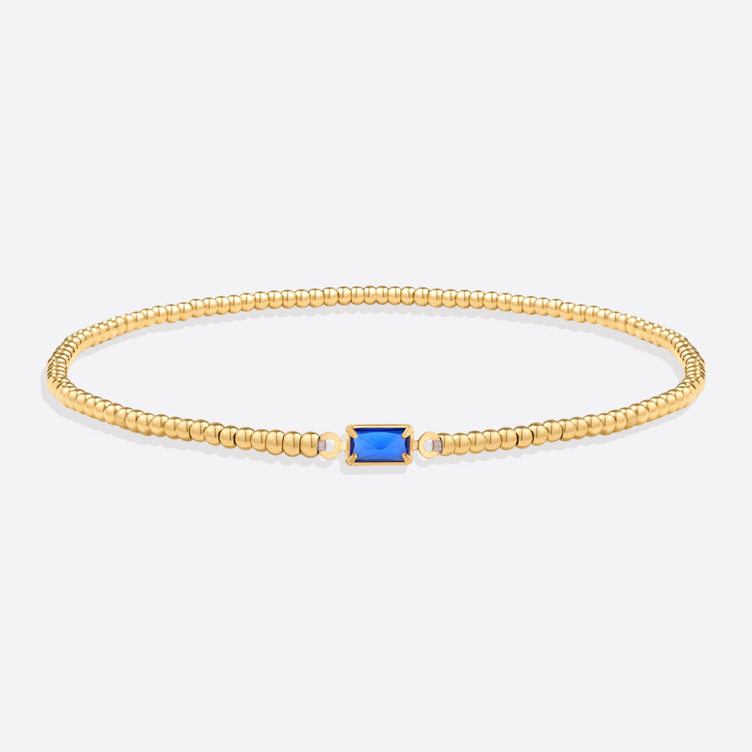Pulsera de cuentas doradas con piedra natal