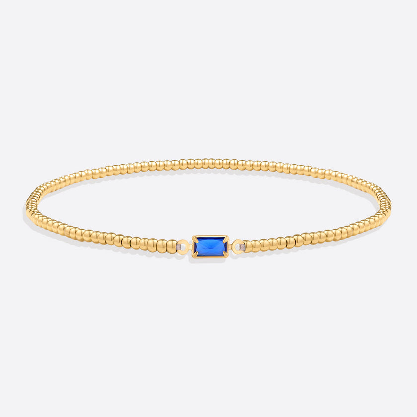 Pulsera de cuentas doradas con piedra natal