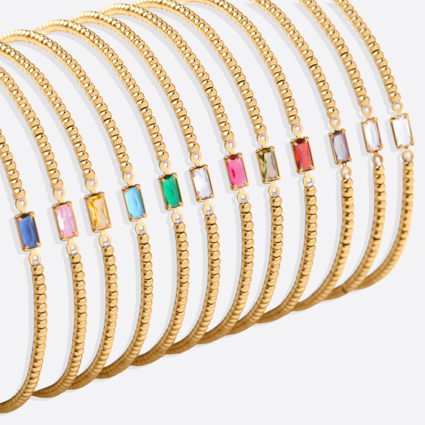 Pulsera de cuentas doradas con piedra natal