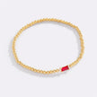 Pulsera de cuentas doradas con piedra natal