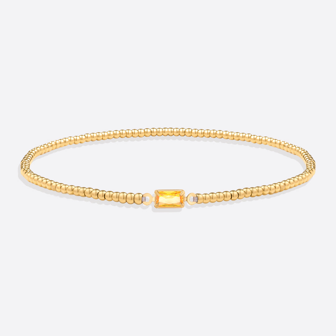 Pulsera de cuentas doradas con piedra natal