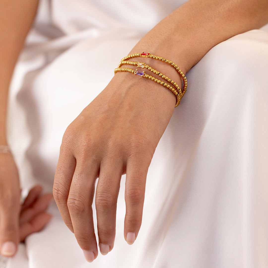 Pulsera de cuentas doradas con piedra natal
