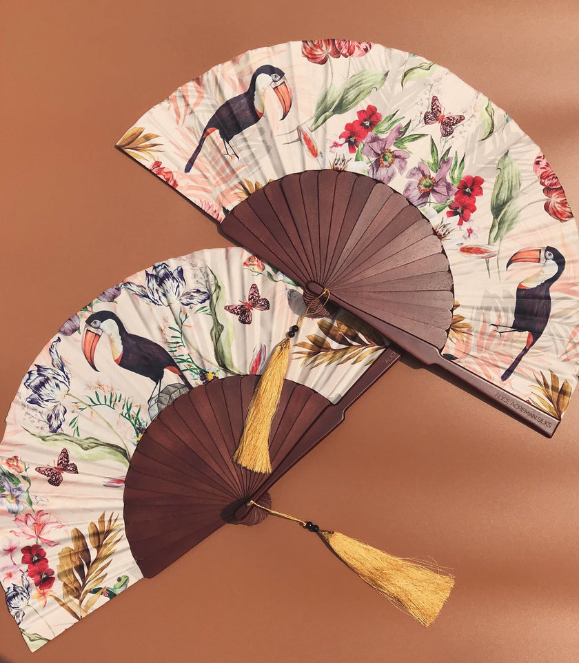 Floral Silk Fan with Toucan design and luxurious Gold tassel, part of the Mysa Collection