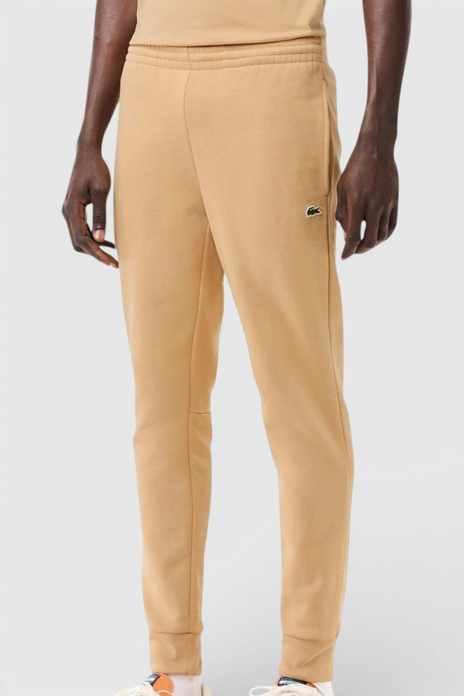 Pánské tepláky Lacoste z biobavlny ve střihu slim fit, béžové